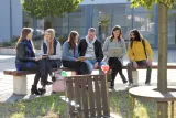 Friends enjoying each other's company on a bench